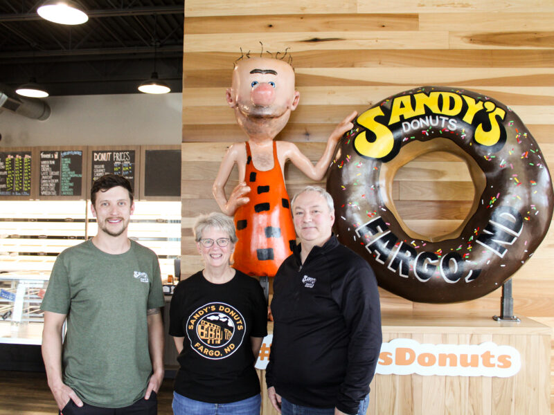 Jeff Ostlund, Joan Wilson and Kent Flagtwet of Sandy’s Donuts in Fargo, North Dakota.