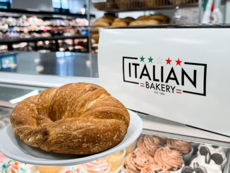 Shot of Italian Bakery-branded box and shop interior