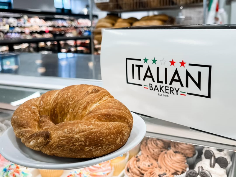 Shot of Italian Bakery-branded box and shop interior