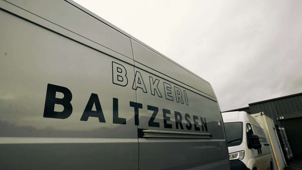 Photo of Cybake ERP user Bakeri Baltzersen's delivery vans leaving bakery.
