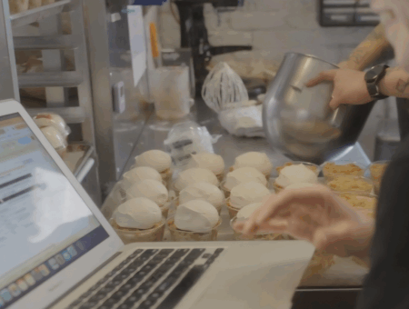 Photo of bakers using Cybake on a laptop