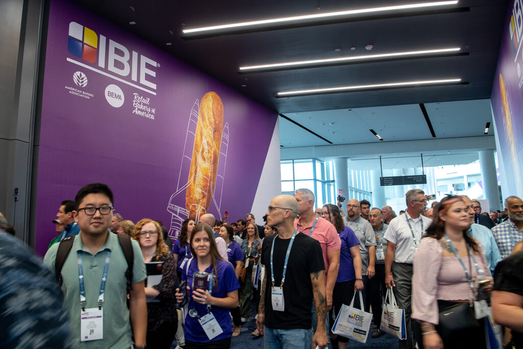 Photos of crowd of attendees entering the International Baking Industry Exposition in 2022.