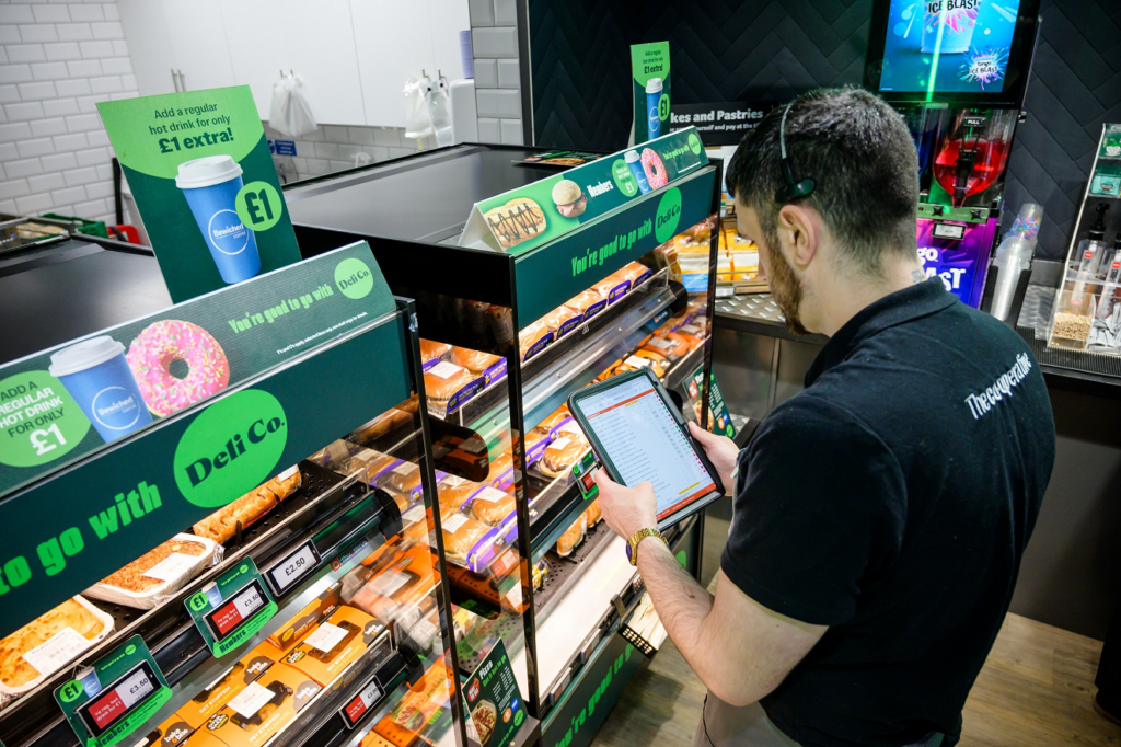 Photo of store colleague using Cybake ISB at at Heart of England Co-operative’s store in Lower Heathcote, Coventry