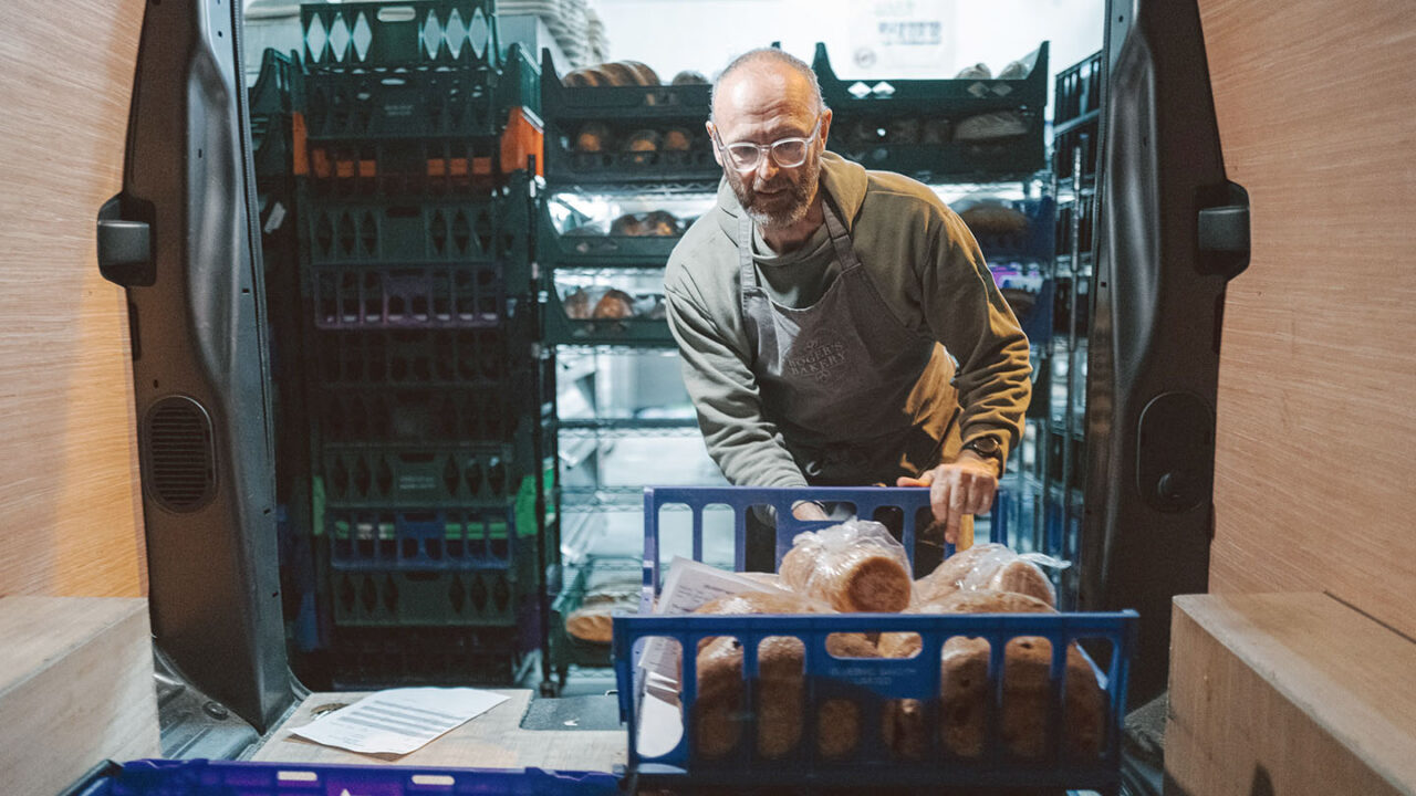 : Picture of Roger’s Bakery owner Roger Haycock filling one his delivery vans