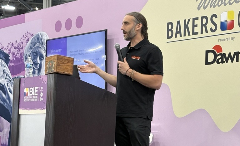 Photo of Cybake's Luke Karl speaking at IBIE